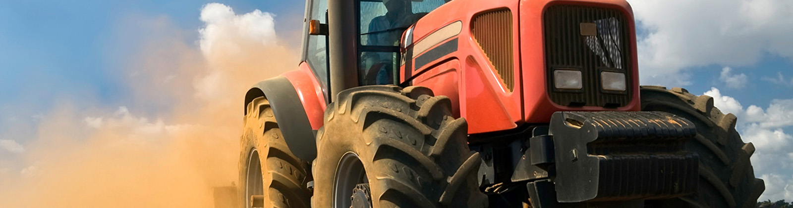 Close up of large orange tractor